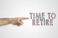 HR, retirement, compulsory retirement concept. Hand pointing outdoors next to the text: time to retire. Royalty Free Stock Photo