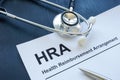 HRA health reimbursement arrangement application and stethoscope.