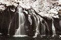 Hraunfossar is a series of waterfalls formed by rivulets streaming over a distance of about 900 metres. Royalty Free Stock Photo