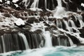 Hraunfossar is a series of waterfalls formed by rivulets streaming over a distance of about 900 metres out of Hallmundarhraun. Royalty Free Stock Photo