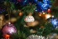 ÃÂ¡hristmas ball in shape of muffin on Christmas tree.