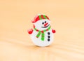 Hristmas decorative doll of snowman on wood