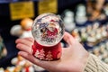 ÃÂ¡hristmas snowdome with Santa Claus inside it on palm Royalty Free Stock Photo