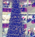 ÃÂ¡hristmas tree in shopping mall, defoused holiday background Royalty Free Stock Photo