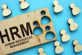 HRM human resources management concept. Wooden figures on the  background Royalty Free Stock Photo