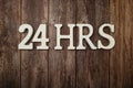 24 HRS alphabet letters with space copy on wooden background