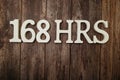 168 HRS Number of hours in a week with space copy on wooden background