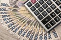 500 hryvnia bills with calculator  as background. Close up. Top view Royalty Free Stock Photo