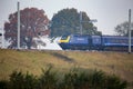 HS125 Train passing partially completed electrification