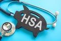 HSA health savings account. Stethoscope and piggy bank. Royalty Free Stock Photo