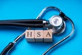 HSA Health Savings Account Wooden Blocks Near Stethoscope Royalty Free Stock Photo