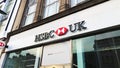 HSBC bank sign logo, located at 50-52 Kilburn High Rd. Static shot.