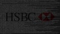 HSBC logo made of source code on computer screen. Editorial 3D rendering