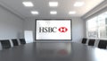 HSBC logo on the screen in a meeting room. Editorial 3D rendering