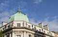 HSBC UK Doncaster bank with roof dome and statues details against a blue sky with clouds.