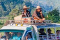 HSIPAW, MYANMAR - NOVEMBER 30, 2016: Local people travel on a roof of a truck near Hsip Royalty Free Stock Photo