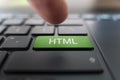 HTML computer language. writing on button modern of gray laptop. Finger presses the button. Programmer for work