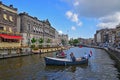 People enjoying beer and cruise of private Boat Ride on Amsterdam Canal with Flag of the Netherlands