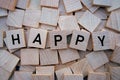 White Wooden blocks with letters spelling Happy