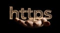 Https security internet and technology concept with glowing text floating above open hand Royalty Free Stock Photo