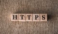 HTTPS word written on wooden blocks on a brown background