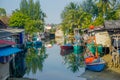 Hua Hin, Thailand - April 26, 2019: Multicolored fishing boats in the bay