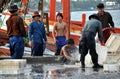 Hua Hin, Thailand: Fishermen washing Crates