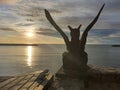 Hua hin, Thailand- June 28, 2020: A silhouette stone statue against a cloudy sunrise sky backdrop . Fairytale animal look at sea.