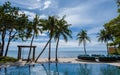 Hua Hin Thailand, tropical pool with palm trees at a luxury resort of Movenpick in Huahin