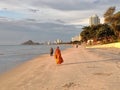Hua Hin, Thailland - June 2019: Monque is walkimg on the morning beach