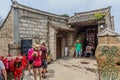 HUA SHAN, CHINA - AUGUST 4, 2018: People visiting Dulong Temple at the Hua Shan mountain in Shaanxi province, Chi