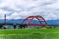 A train across a m-type Red Bridge on the lush paddy fields, is Taiwan sight in East on August 14 2018 in Hualien, Taiwan