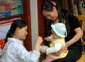 Huang Long Xi, China: Feeding Baby