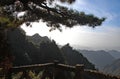 Huangshan Mountain in Anhui Province, China. View of distant mountain peaks and trees near Sanxi Bridge and Fairy Walking Bridge Royalty Free Stock Photo