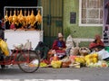 Huaraz, Ancash / Peru: 11 June 2016: horizontal view of indigent Indio farmer women sell their fruit and vegetables on the streets