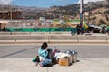 HUARAZ, PERU - NOVEMBER 29, 2014: Small saleswoman in the streets of Huaraz in sun