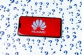 HUAWEI logo on the HUAWEI smartphone and a lot of paper question marks around.