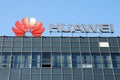 Huawei telecom company logo on office building  against clear blue sky Royalty Free Stock Photo