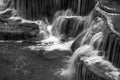 Huay Maekamin Waterfall in Kanchanaburi, Thailand; black and white monochrome photo Royalty Free Stock Photo