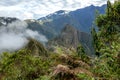 Huayna Picchu, or Wayna Pikchu, mountain in clouds rises over Machu Picchu Inca citadel, lost city of the Incas Royalty Free Stock Photo