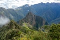 Huayna Picchu, or Wayna Pikchu, mountain in clouds rises over Machu Picchu Inca citadel, lost city of the Incas