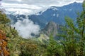 Huayna Picchu, or Wayna Pikchu, mountain in clouds rises over Machu Picchu Inca citadel, lost city of the Incas