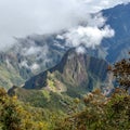 Huayna Picchu, or Wayna Pikchu, mountain in clouds rises over Machu Picchu Inca citadel, lost city of the Incas