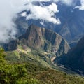 Huayna Picchu, or Wayna Pikchu, mountain in clouds rises over Machu Picchu Inca citadel, lost city of the Incas Royalty Free Stock Photo