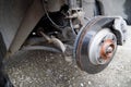 the hub of the front wheel of a jacked car during a tire change