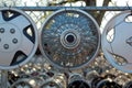 Hubcaps on a Chain-Linked Fence