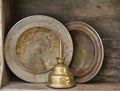 Hubcaps and tall oil can on old garage shelf