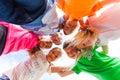 A huddle of school kids looking down at camera, Royalty Free Stock Photo