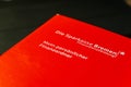 Hude, Deutschland, 07.07.2020:  Fotos eines Sparkassen Ordners in rot liegend auf einem Schreibtisch Royalty Free Stock Photo