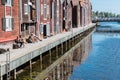 Hudiksvall, Halsingland, Gavleborg County -Sweden -Reflecting fishing warehouses in the city center Royalty Free Stock Photo